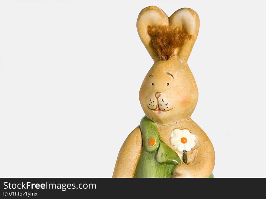 Easter-bunny with flower in front of a white background