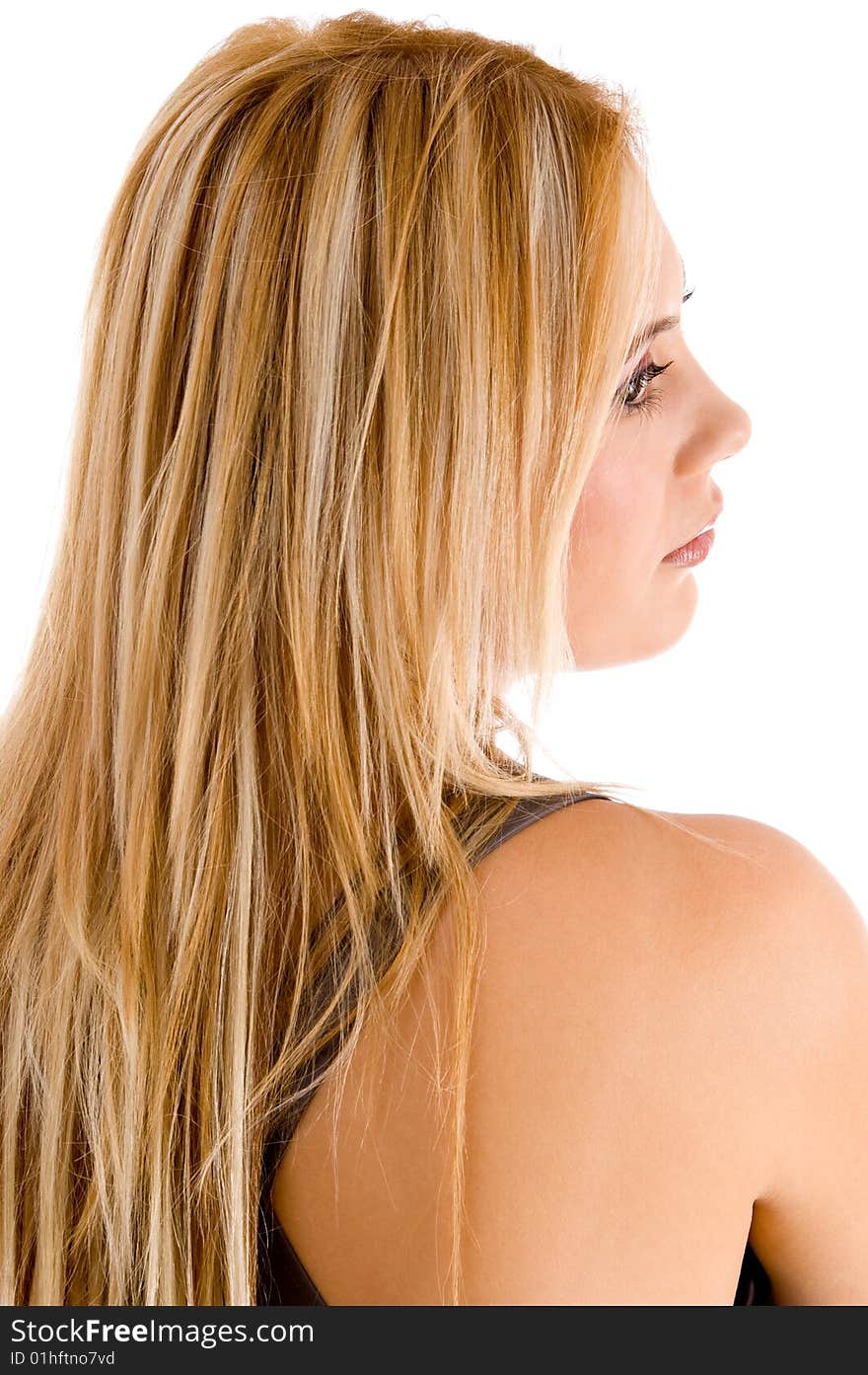 Back pose of blond female against white background