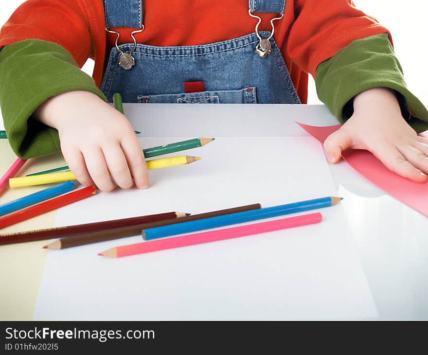 Many color pencils in children's hands. Many color pencils in children's hands