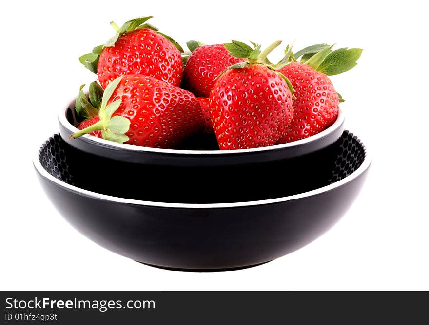 Bowl full of nice ripe strawberries isolated on white. Bowl full of nice ripe strawberries isolated on white.