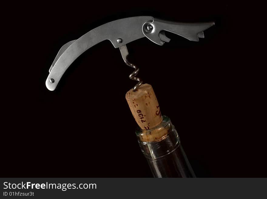 Wine bottle opener, isolated on a bleck background