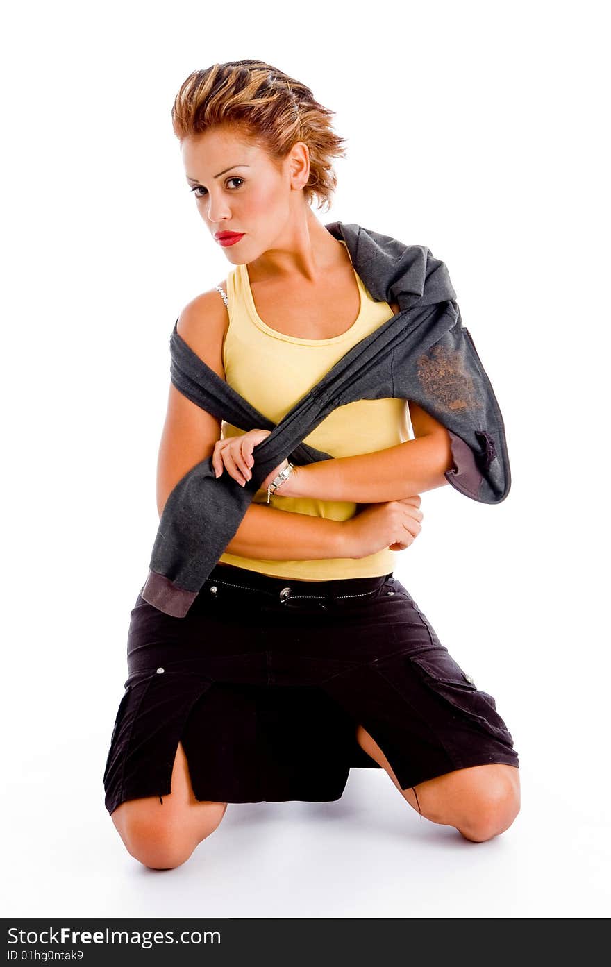 Sexy model posing with jacket against white background