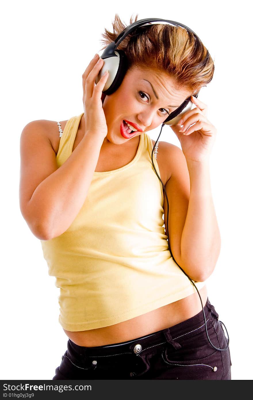 Attractive model wearing headphone against white background