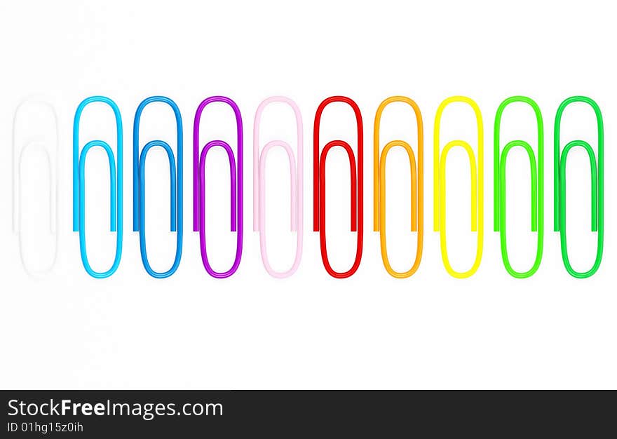 Coloured paperclips on white background.