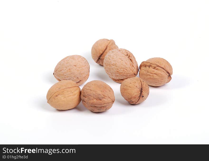 Lot of whole nuts on a white table