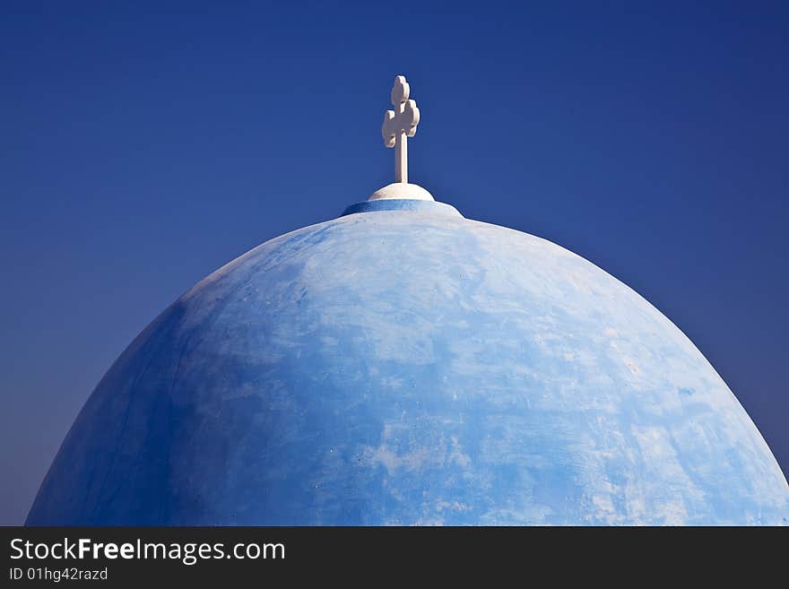 A beautiful blue domed church on the island of Santorini, Greece. A beautiful blue domed church on the island of Santorini, Greece.