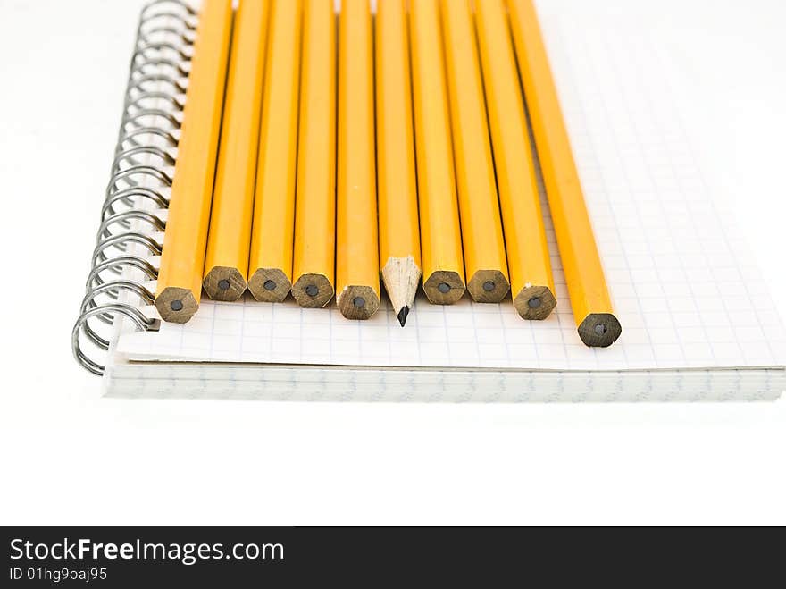 Spiral notepad with a set yellow wooden pencils. Spiral notepad with a set yellow wooden pencils.