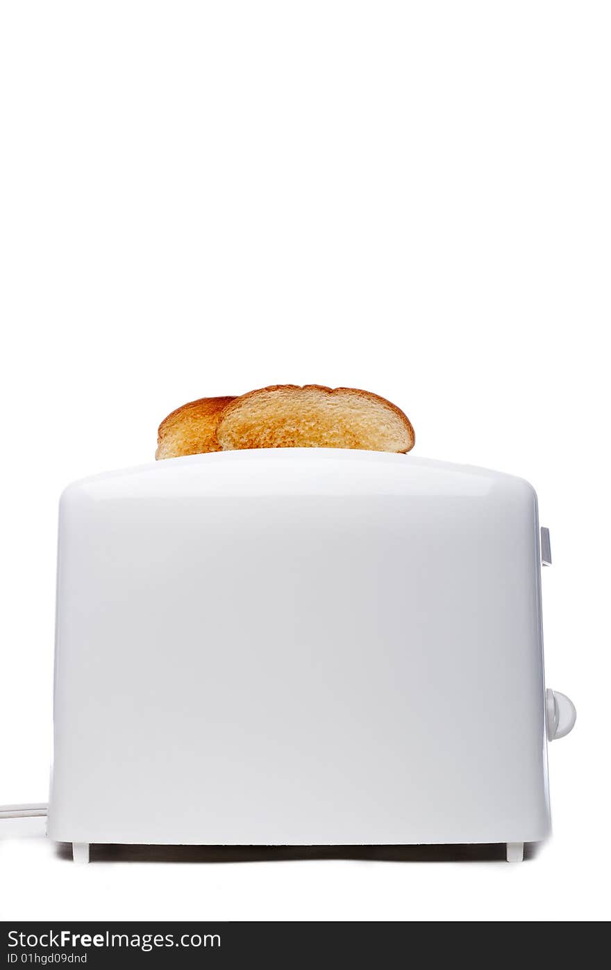 Toasted bread popping up from a white toaster. Toasted bread popping up from a white toaster