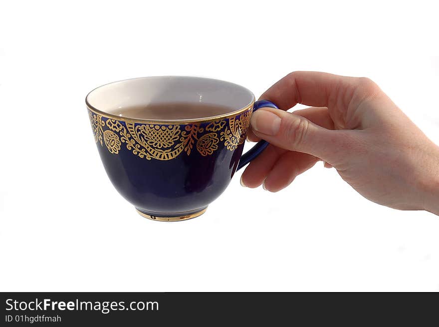 Arm holding cup with tea