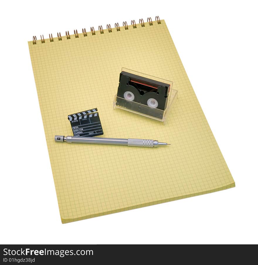 Yellow spiral bound notepad with pen and calculator isolated on white