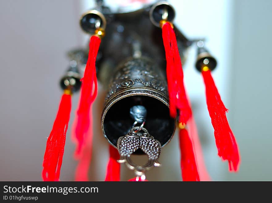 Old chinese bronze bell with dragons and hieroglyphs - on defocused (blurred) background. Old chinese bronze bell with dragons and hieroglyphs - on defocused (blurred) background.