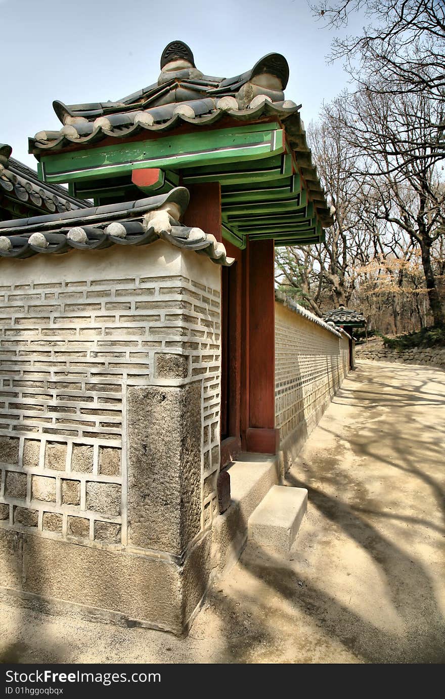 Asian Palace against forest and blue sky