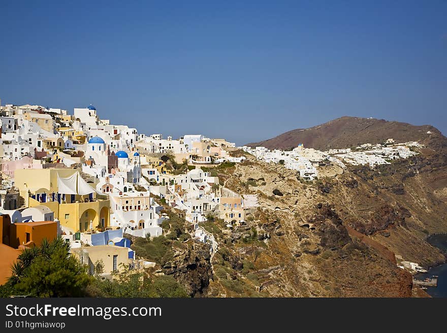 Oia is a village built along a cliff-top. On the greek island called Santorini on the northern tip. Oia is a village built along a cliff-top. On the greek island called Santorini on the northern tip.