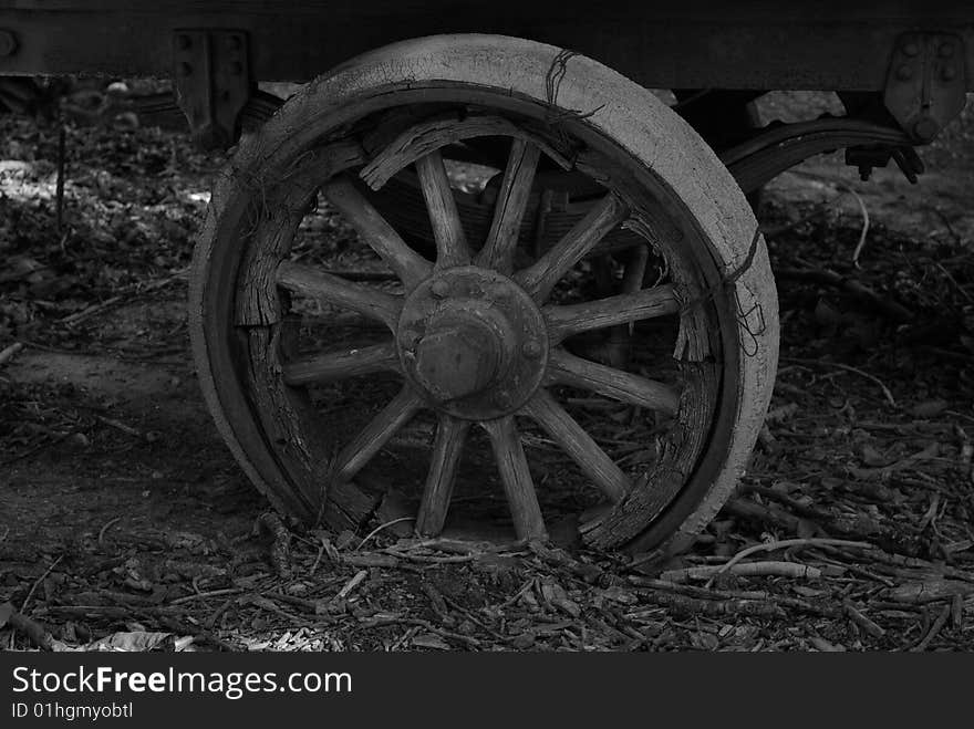 Old wheel on an anicent trailor. Old wheel on an anicent trailor