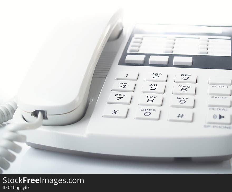 Modern white business office telephone  on a white background