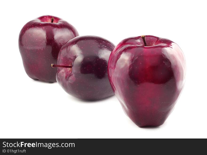 Three red apples in a row isolated on white background with copy space