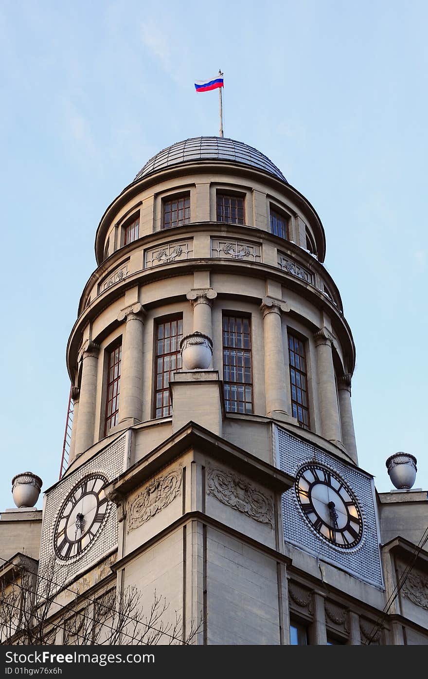 Horologium with russian flag. Building tower in Moscow, capital of Russian Federation