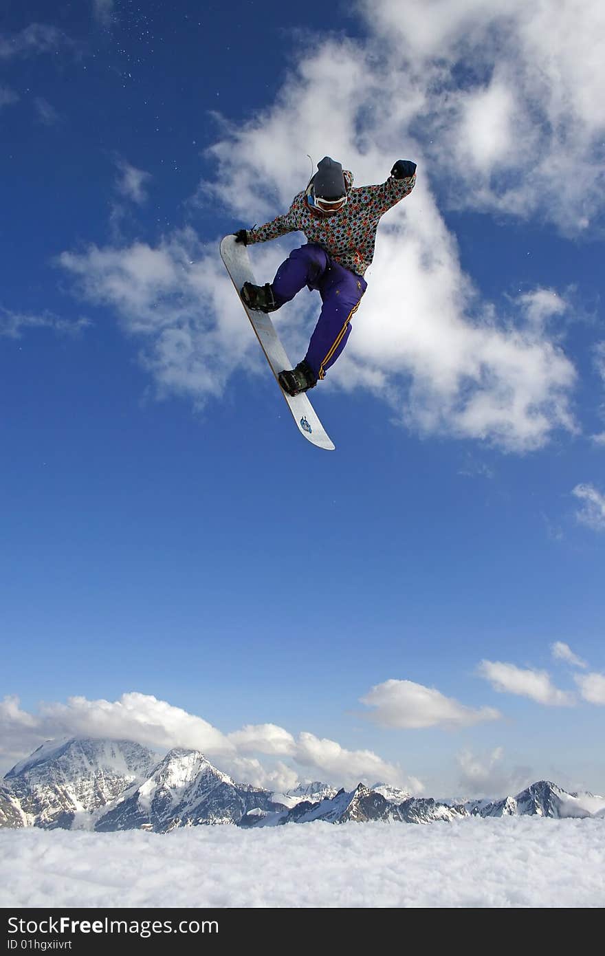 Modern snowboarder jumping very high at springboard. Modern snowboarder jumping very high at springboard