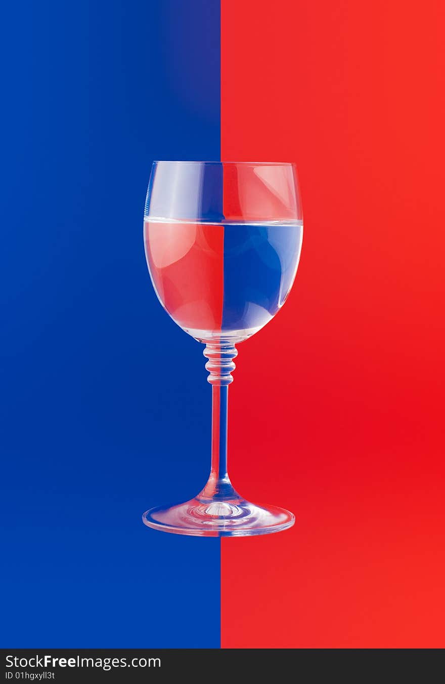 Water glass on the two color background. Water glass on the two color background