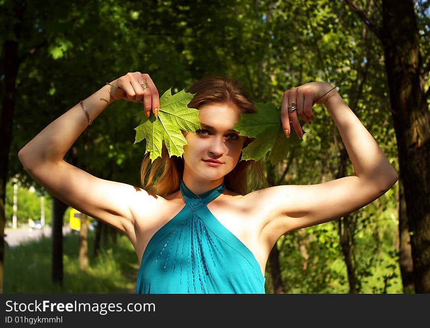 Woman holds maple leaves