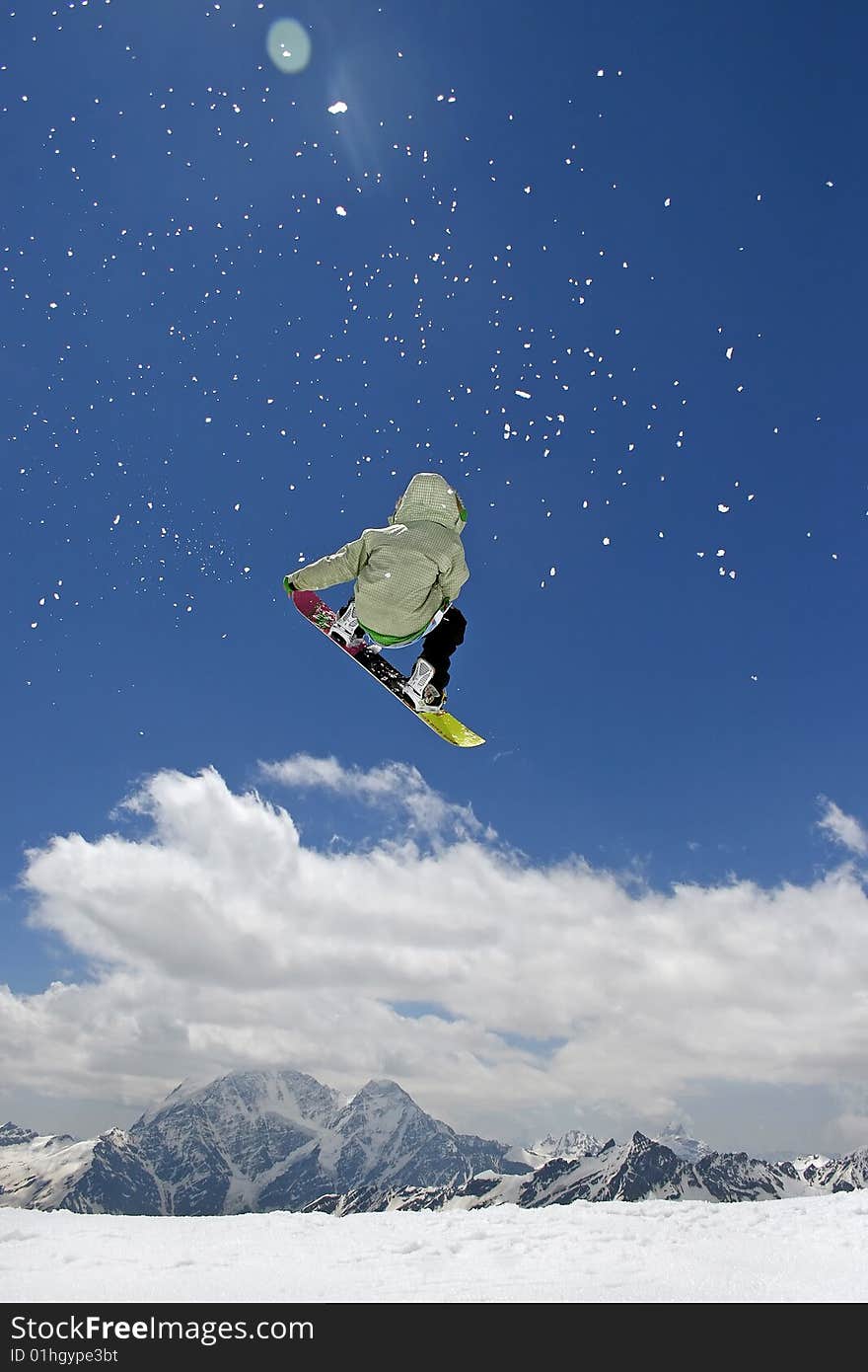 Modern snowboarder jumping very high at springboard. Modern snowboarder jumping very high at springboard