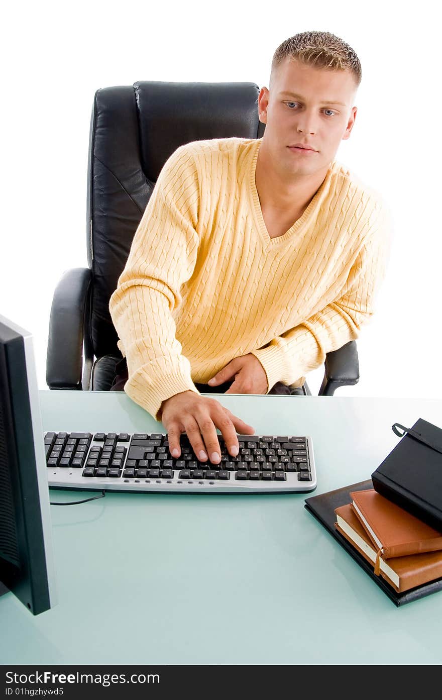 Handsome guy working on computer on an isolated background