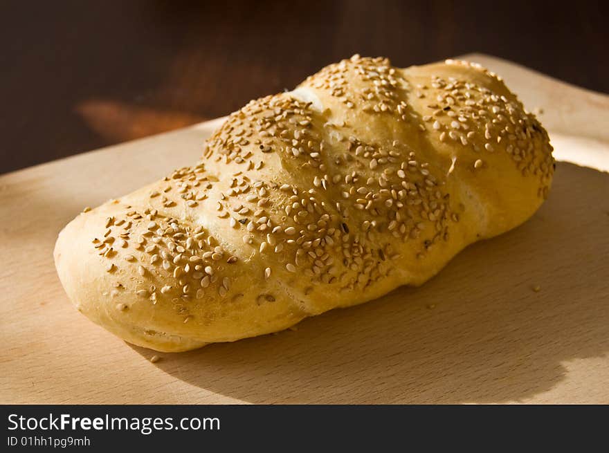 A bread loaf on a wooden table