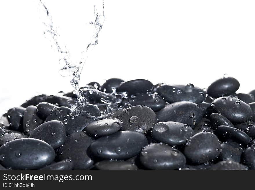 Background rock with splashing water.