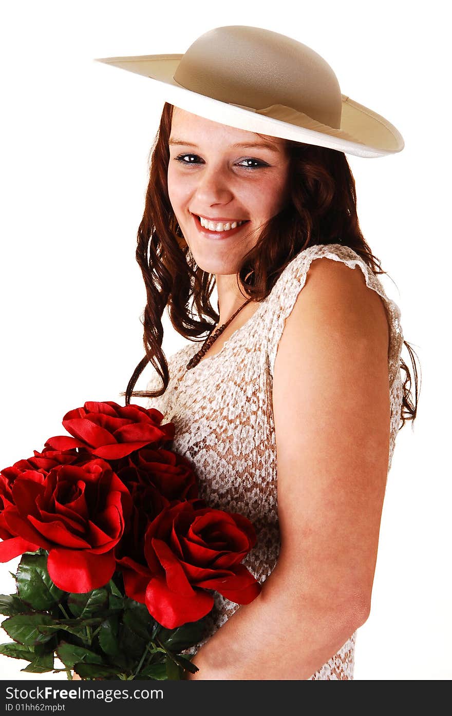 Beautiful lady in a beige dress and hat standing in the studio with red roses
in her arm's smiling, for white background. Beautiful lady in a beige dress and hat standing in the studio with red roses
in her arm's smiling, for white background.