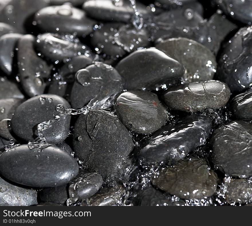 Background rock with splashing water.