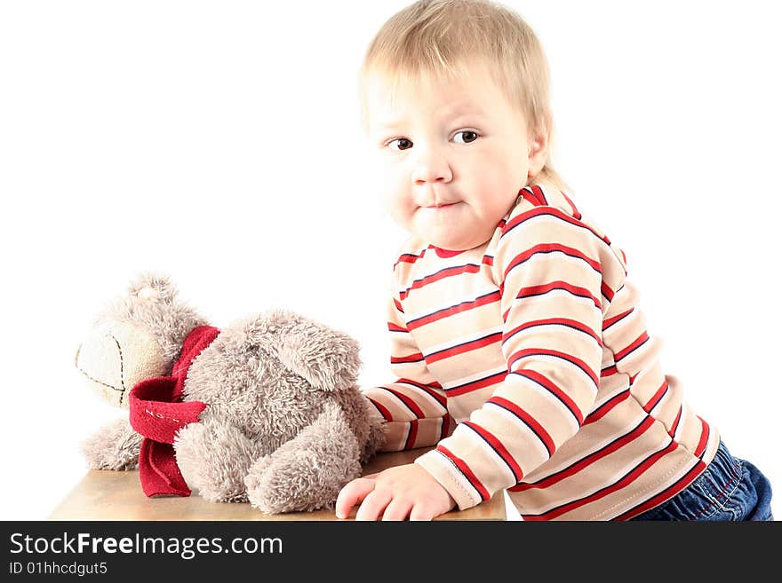 Little blond boy with teddy bear isolated on white background