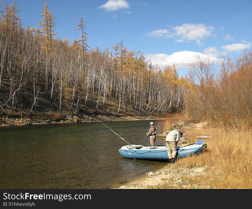 Boatfishing on river in Aljaska