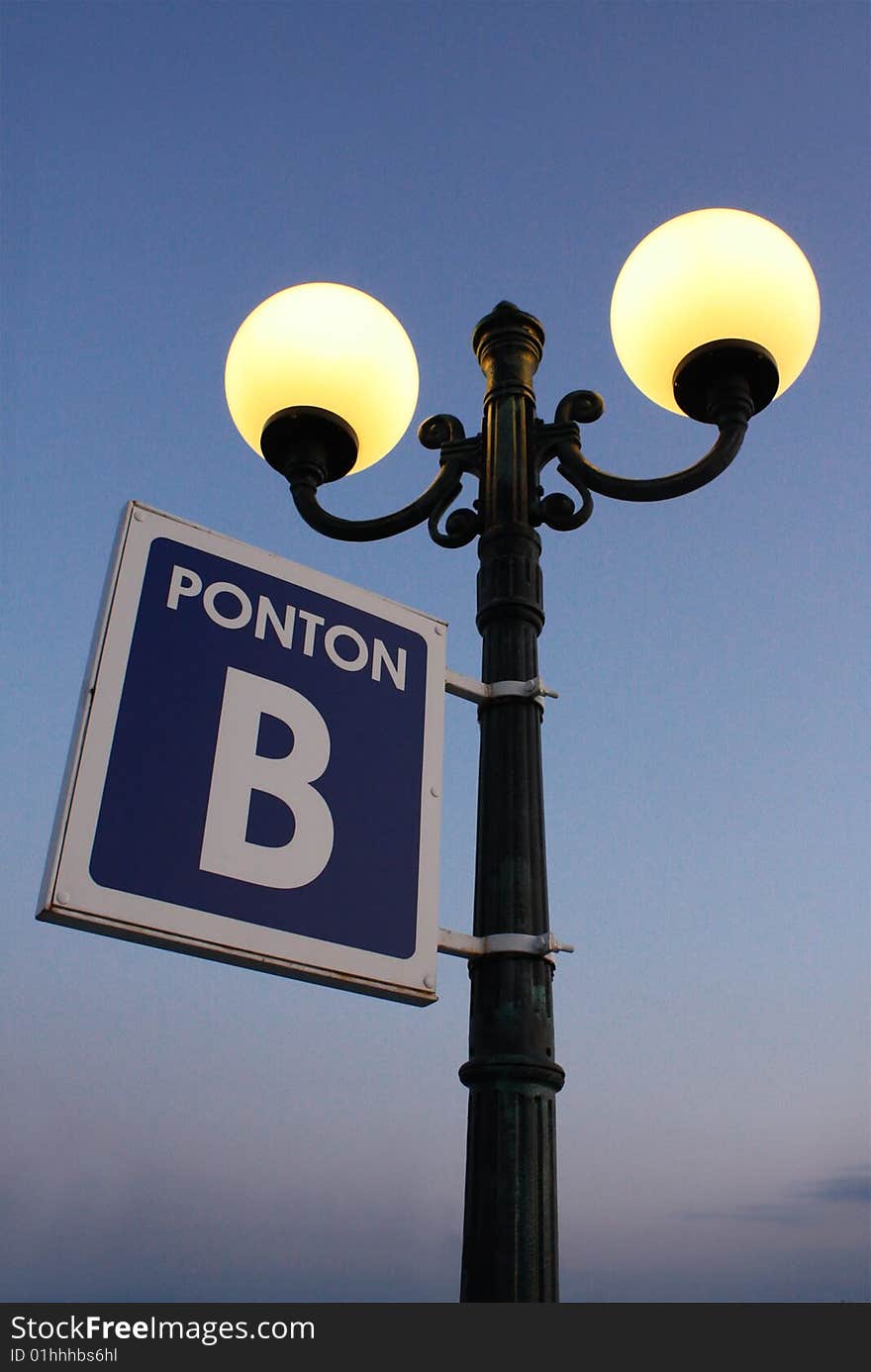 Street Lamp With Plate On Pier