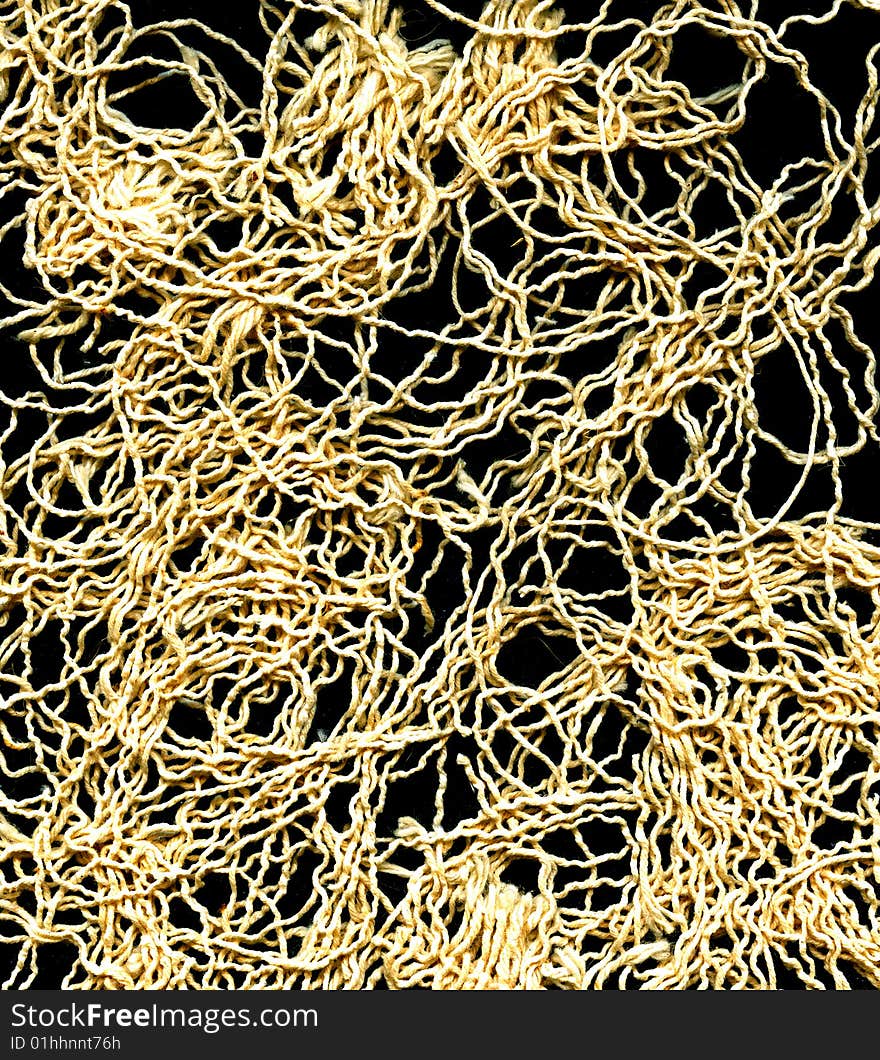 Strands of yellow threads over black