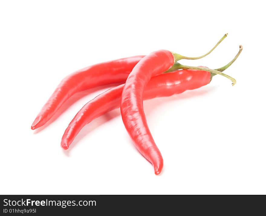 Red  chilly peppers   on white background