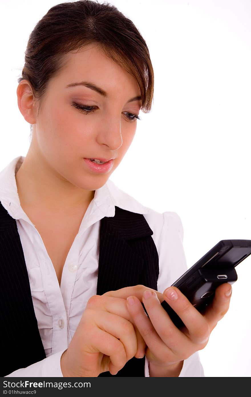 Front view of female executive using cellphone against white background