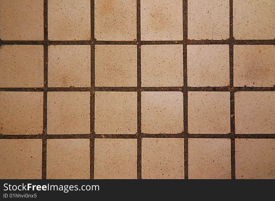 Old square tiles texture background close up. Old square tiles texture background close up