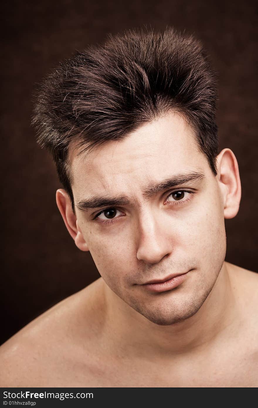 Young man with dark hair facial expression. Young man with dark hair facial expression