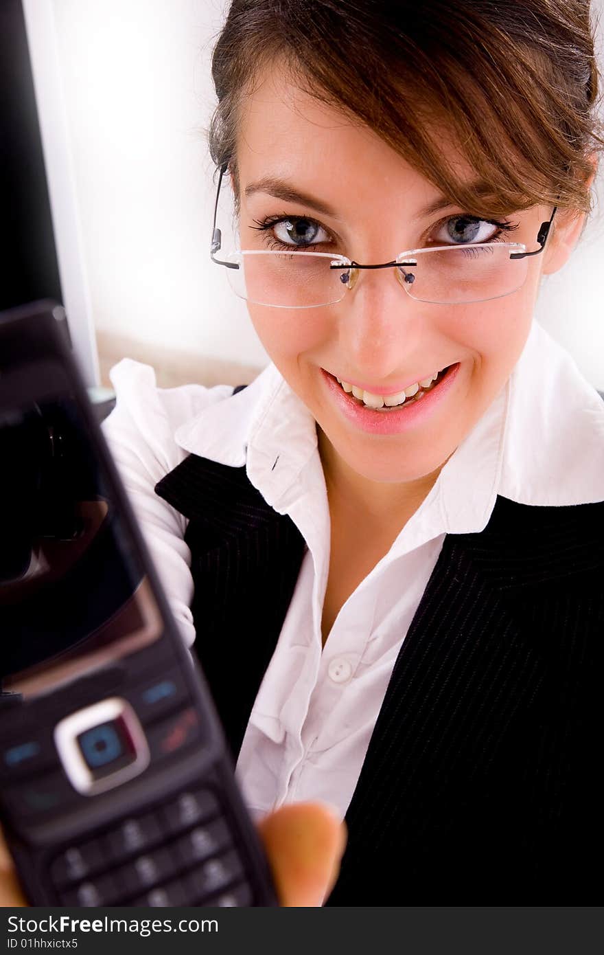 Smiling businesswoman showing her cellphone