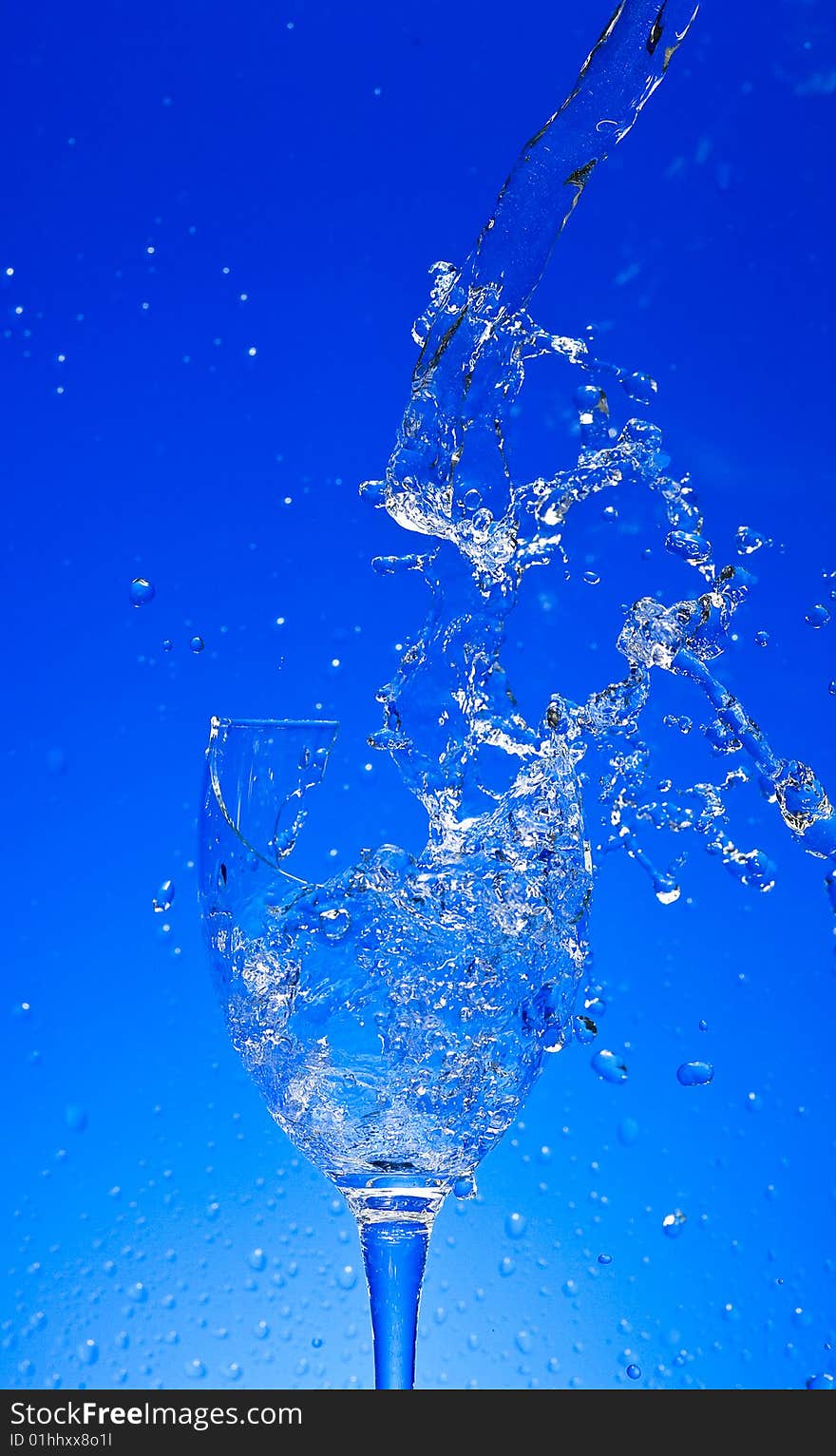 Glass with Splashing water. Coolness Drink