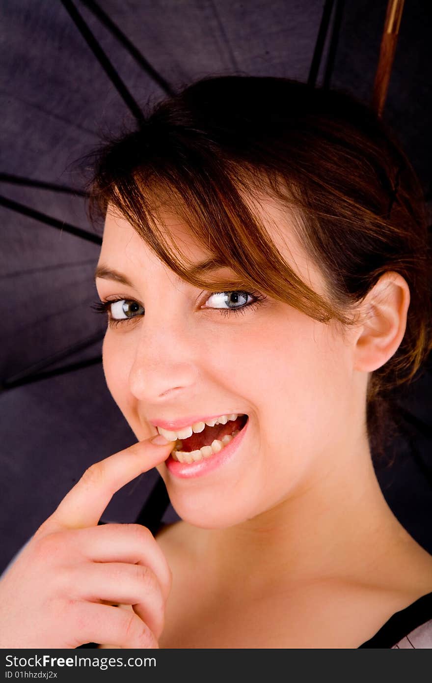 Front view of happy woman with umbrella