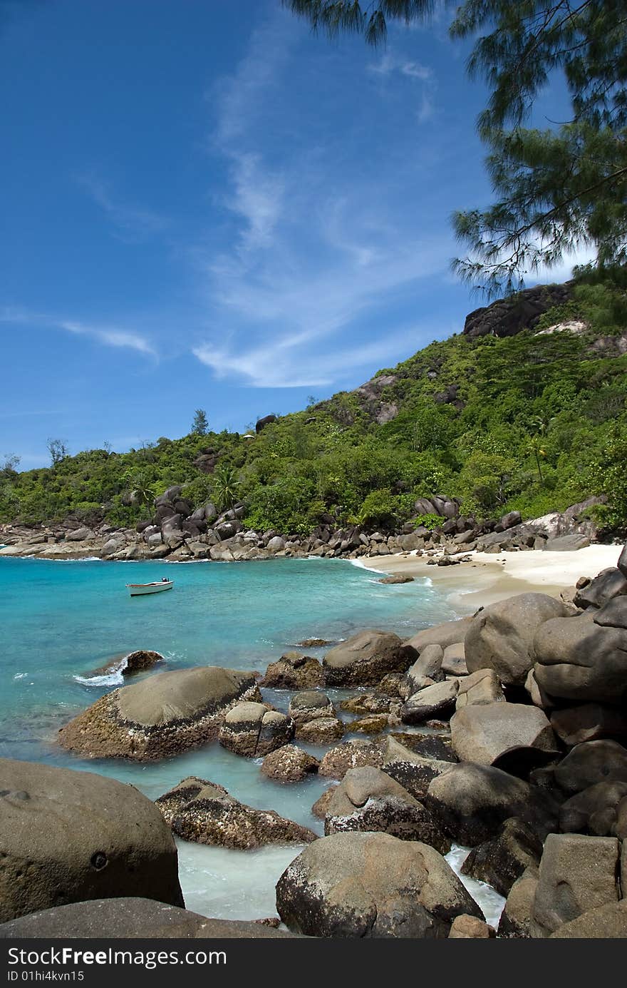 Seychelles stones and palm trees on the bank of azure ocean. Seychelles stones and palm trees on the bank of azure ocean