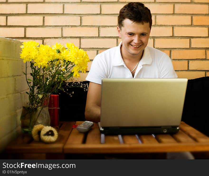 Young handsome man is working on laptop. Young handsome man is working on laptop