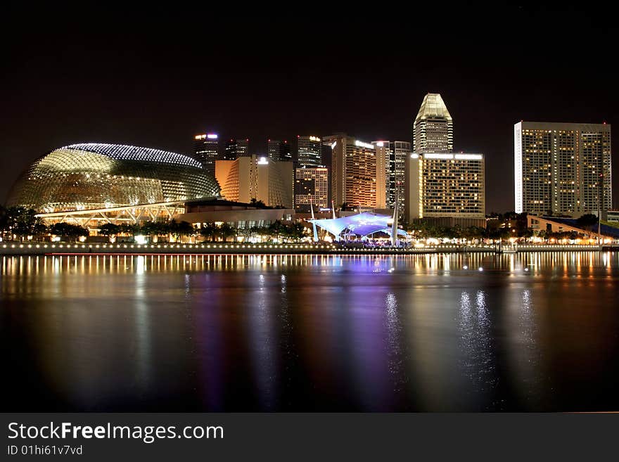 Singapore skyline at night by the Singapore river.