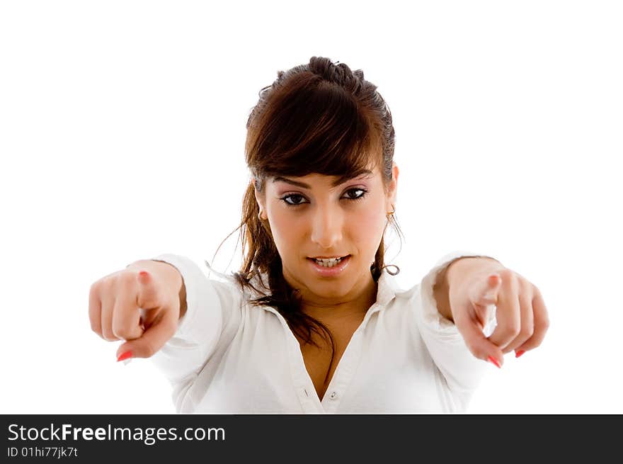 Portrait of young pointing businesswoman against white background