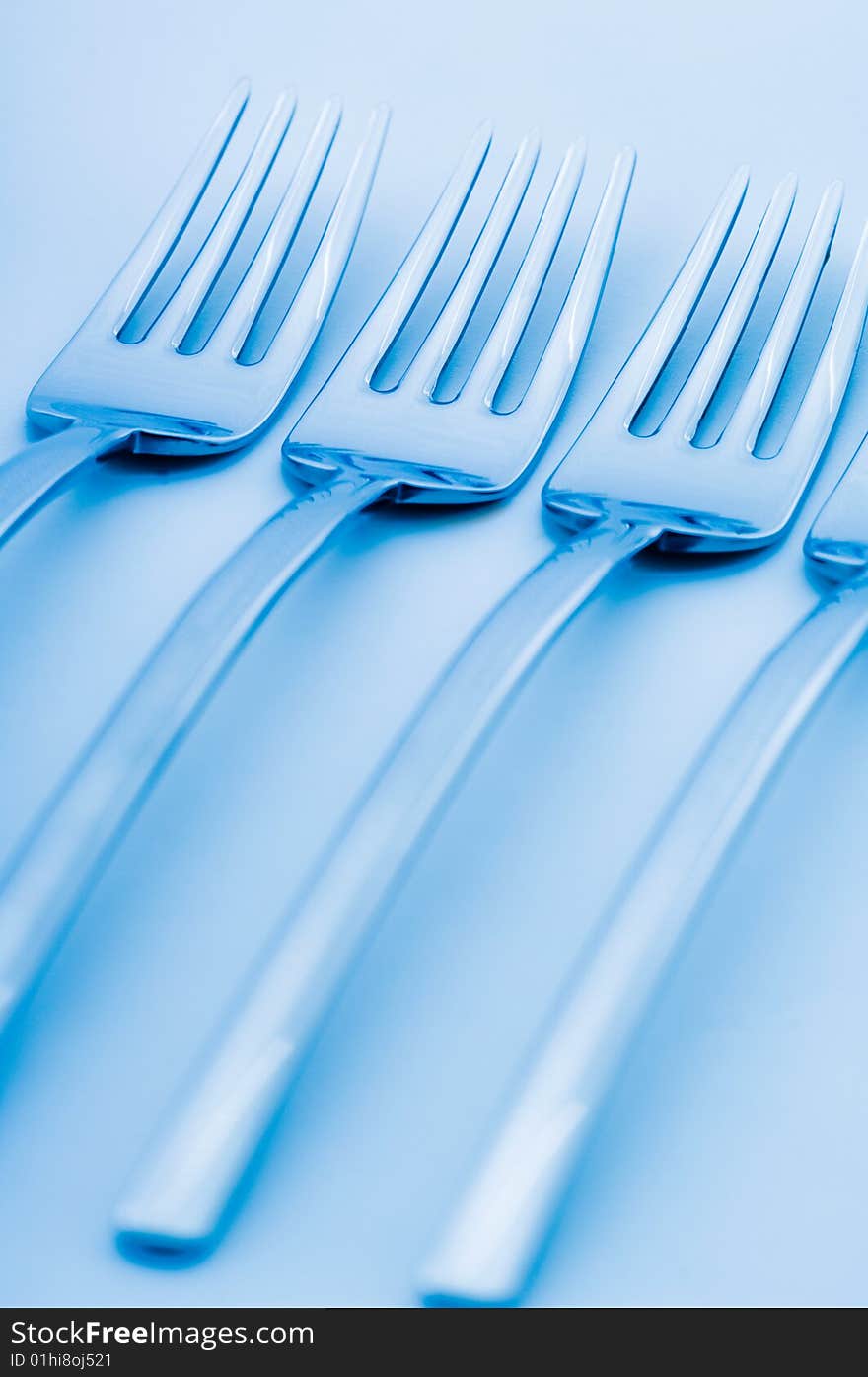 Set of forks with blue toning