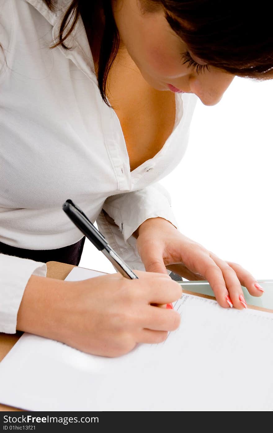 Side pose of businesswoman signing the papers