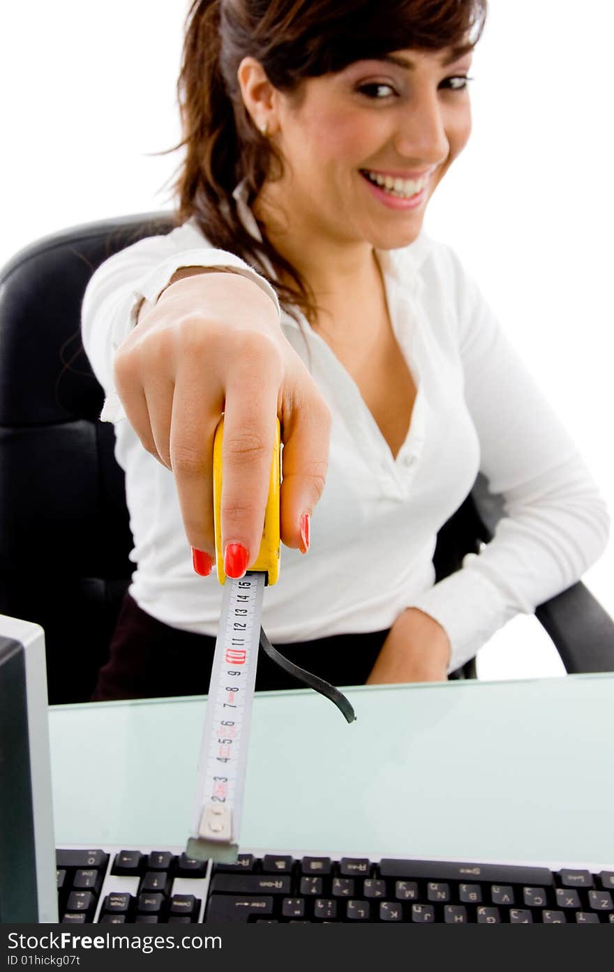 Front view of smiling woman showing measurement tape on an isolated background