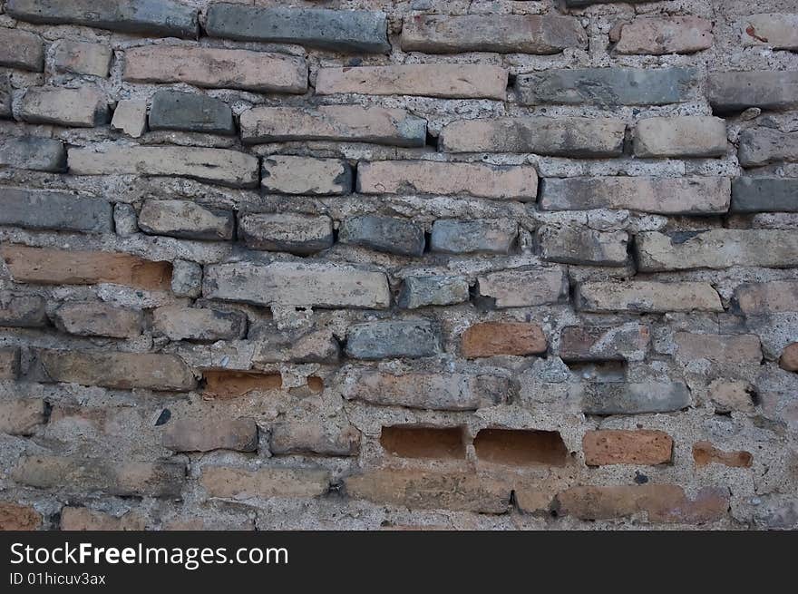 Old grey brick wall background