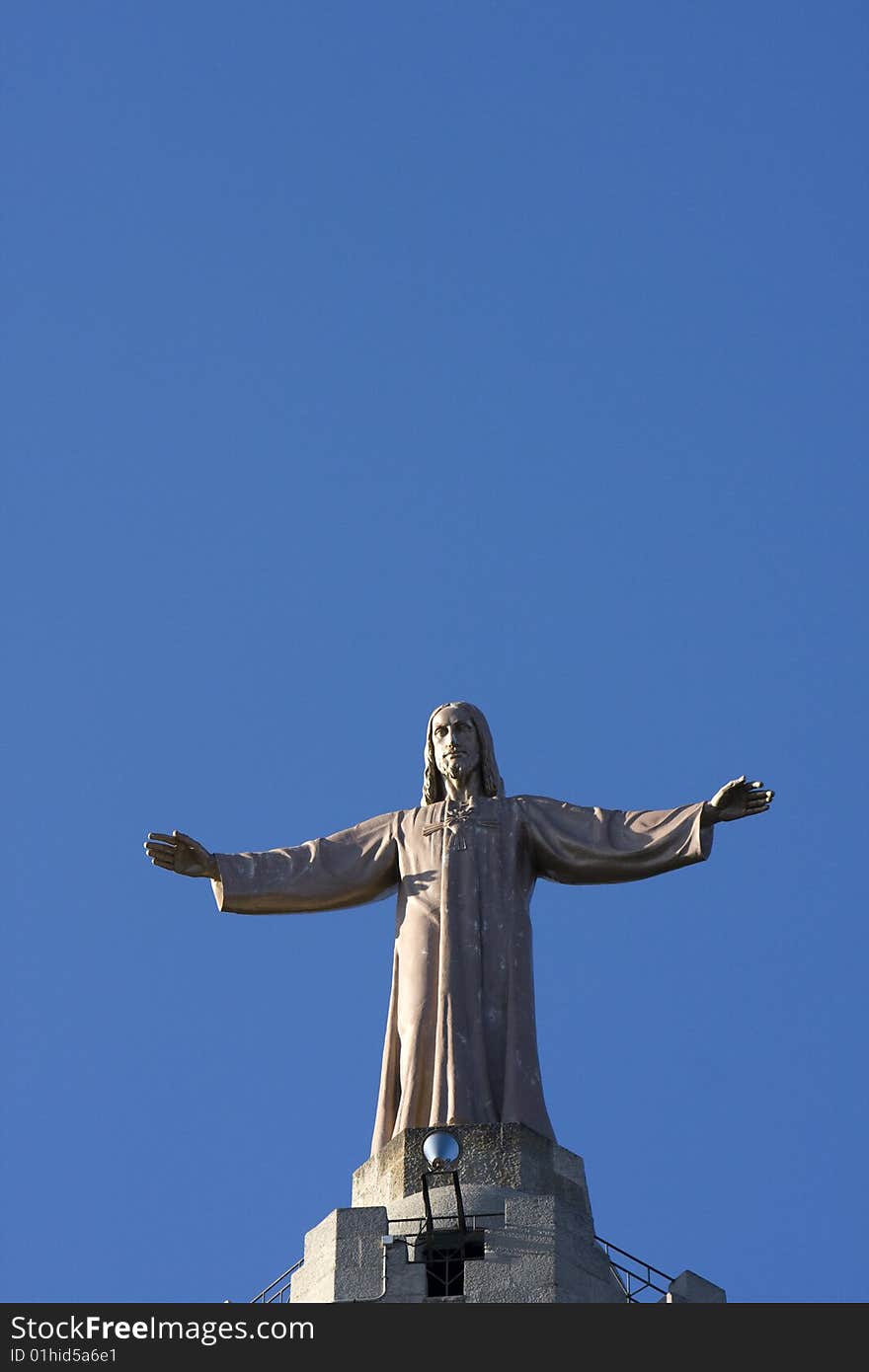 Jesus Statue on the top of the Tividabo church. Jesus Statue on the top of the Tividabo church